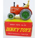 Dinky Toys die-cast model 310 Field-Marshall Tractor, orange body with green hubs,