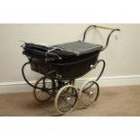 Mid 20th century Tri-ang Dolls pram, green painted metal body on leather sprung frame,