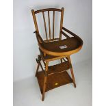 Early 20th century Child's metamorphic high chair, with cast iron wheel,