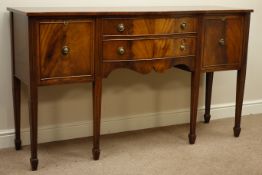 Regency style mahogany serpentine sideboard with two drawers and two cupboards on reeded square
