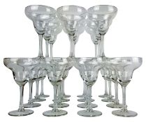 Set of twenty four Champagne glasses, bell shaped bowls on plain stems and circular bases,