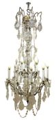 Large gilt metal chandelier, fifteen branches in two tiers around a central glass covered column,