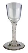 Georgian Wine glass with ogee bowl and single opaque air twist stem on domed foot, H13.
