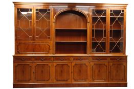 George lll style yew library bookcase with four glazed doors above six drawers & six panel doors,