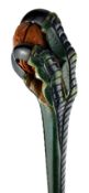 Green painted walking cane, handle carved as a scaly claw gripping a walnut, gold plated collar,