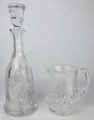 20th century crystal glass bottle shaped decanter and stopper with star cut body & a Stuart crystal