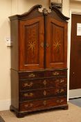 Late 18th century Dutch oak press cupboard with swan-neck pediment and two star inlaid doors above