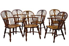 Harlequin set of six 19th century yew and elm double bow low back Windsor armchairs,
