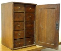 Late 18th century oak spice cupboard, with ten short drawers enclosed by a panel door, W37cm, D35cm,