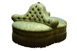 Shoolbred style three seat conversation sofa, upholstered in green fabric with deep fringe, D140cm,