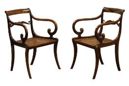 Pair Regency simulated rosewood sabre leg armchairs, scrolled arms and middle rail,