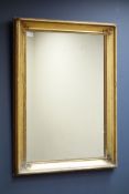 20th century rectangular wall mirror in swept gilt frame, 68cm,