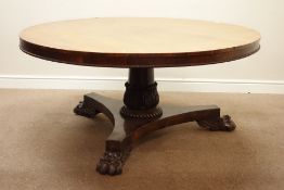 Regency rosewood circular tilt top breakfast table, turned and carved column on trifoil platform,