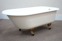 Victorian style enamel roll top bath on ball and claw feet,