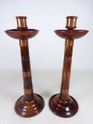 Pair of Arts and Crafts style turned beech copper banded candlesticks,