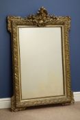 Early 20th century gilt wood and gesso framed wall mirror, shell pediment,