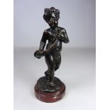 Late 19th Century bronze figure of a cherub on marble base,