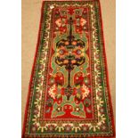 Persian Shiraz green and red ground rug,