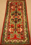 Persian Shiraz green and red ground rug,