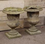 Pair stone effect classical style garden urns,