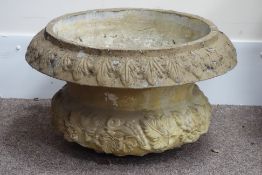Large composite stone garden urn, decorated with berries and leaves, acanthus rim detail,