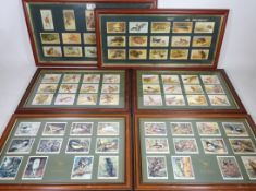 Four framed 'British Birds' and 'Wild Birds' reproduction cigarette cards and two other sets framed