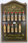 'Mr Culpepper's' spice rack with eleven bottles,