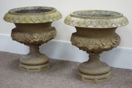 Pair large composite stone garden urns, decorated with berries and leaves, acanthus rim detail,