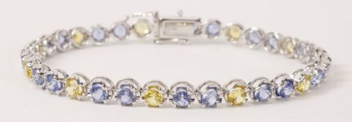 Blue and yellow round sapphire bracelet stamped 750