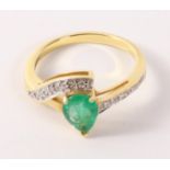 Tear drop Emerald and diamond crossover hallmarked 18ct ring Condition Report