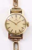 Ladies Omega 9ct gold wristwatch stamped 375 on hallmarked 9ct gold bracelet approx 13.