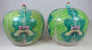 Two Chinese bulbous lidded jars with cabbage leaf and butterfly decoration,