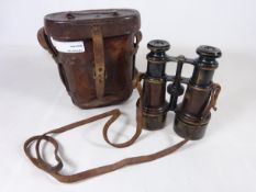 Pair of WWI leather bound binoculars by Heath & co London,