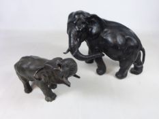 Two cast metal Elephants, one with character mark on base,