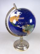 Large polished stone terrestrial globe on stand,