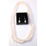 Baroque pearl necklace approx 100cm and pair of ear-rings stamped 925 Condition Report