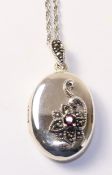 Locket set with garnet and marcasite,