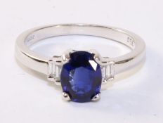 Oval sapphire and baguette diamond white gold ring hallmarked 18ct,