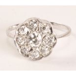 Diamond flower cluster rim set white gold ring stamped 18ct Condition Report <a