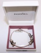 Pandora silver bracelet with eight charms and spacers stamped ALE 925 boxed Condition