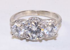 Three stone cubic zirconia cluster ring stamped 925 Condition Report <a