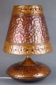 1970's hand made copper table lamp with bulbous body and tapering shade,
