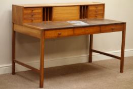 1970's Heal's of London teak desk, raised drawers and hinged compartment, with Heal's badge, W138cm,