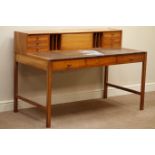 1970's Heal's of London teak desk, raised drawers and hinged compartment, with Heal's badge, W138cm,