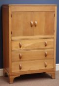 Herbert & Gills Art Deco oak tallboy, fitted with two cupboards and three drawers,