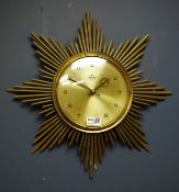 Junghans Ato-Mat brass Starburst wall clock, circular Arabic dial,