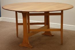 Ercol 'Windsor' light elm drop leaf dining table on gate leg base,