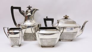 Three piece silver tea set by Atkin Brothers Sheffield 1898 and a matched hot water jug approx 47oz