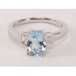 Hallmarked 18ct white gold ring set with and oval aquamarine and baguette diamonds- aqua approx 1.