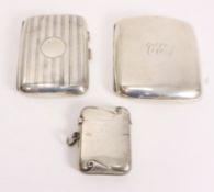 Two early 20th century silver cigarette cases and a vesta case all hallmarked approx 6.